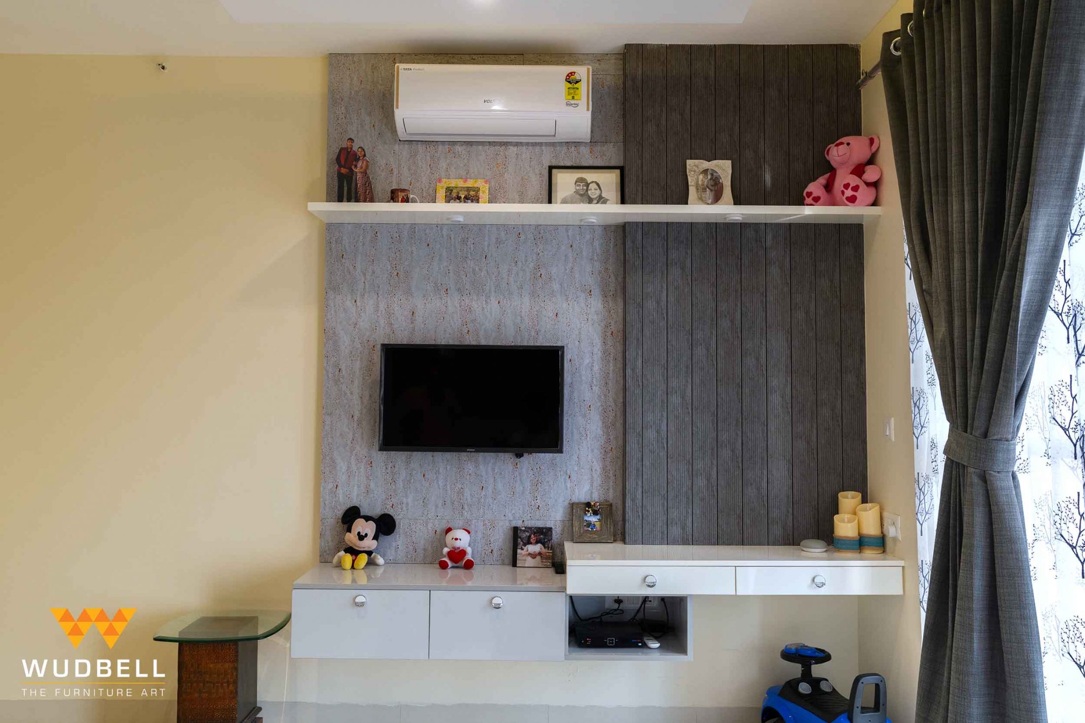The solid wall panelling of the entertainment unit