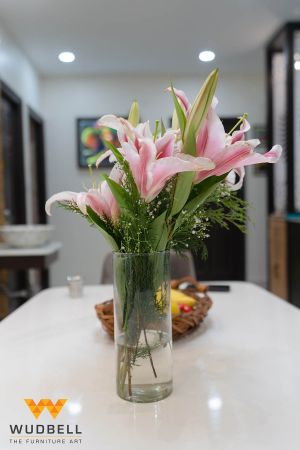 A glass shaped flower vase